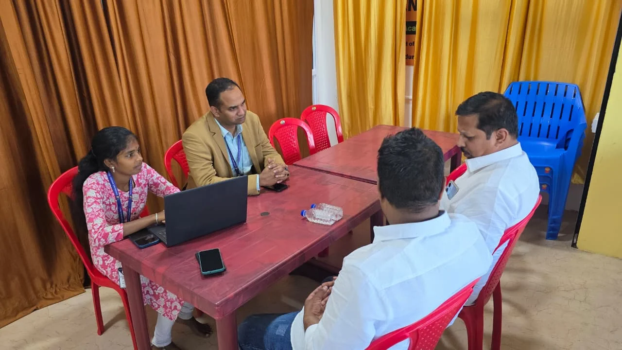 Freshora colleagues discussing a work process